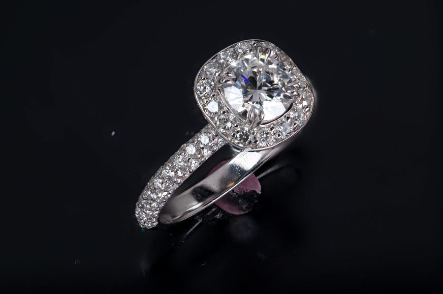 Halo Round featuring Sapphire under bezel and diamond bridge work
