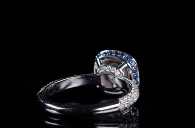 Halo Round featuring Sapphire under bezel and diamond bridge work